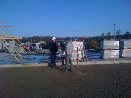 Before we start a project, our boss will go over the site with the guys, so that everyone is on the same page. This allows us to do everything right and it also allows the work to be completed as effectively as possible. In, this picture, Albert (our boss) is explaining how the grading must work for the interlock/turf area which will be a showcase for the cars when completed. 