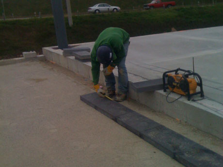The final screed is completed, now it is time to start laying the brick! At the beginning of the process we had setup our string line which we needed one running one way and one running another but they had to intersect creating a 90 degree corner, and that is where we began to lay; we continued laying the border along the string and then lay the inlay later on.